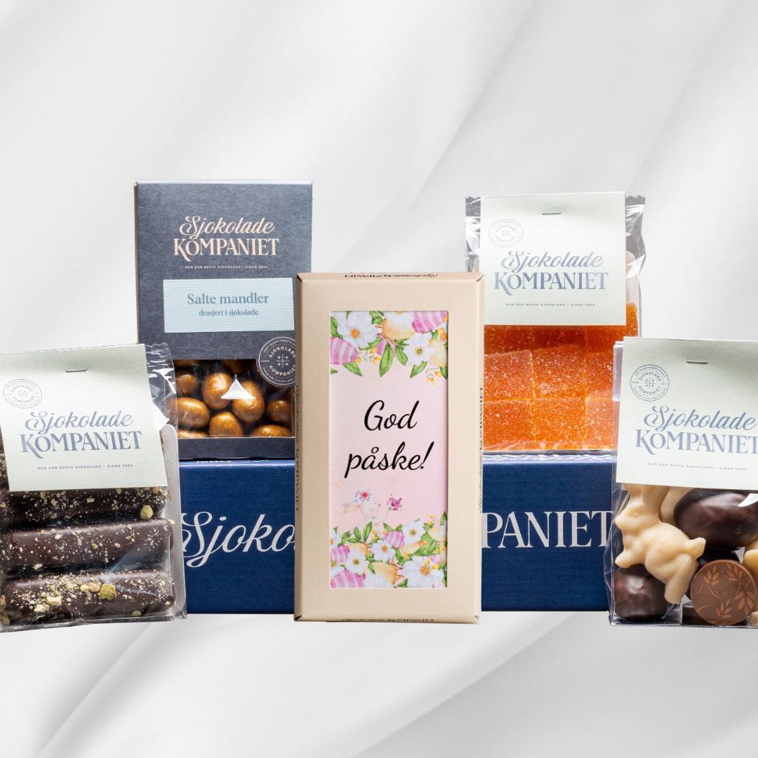 Påskepakke fra Sjokoladekompaniet med sjokolade, marsipan og gelé i gaveeske på hvit bakgrunn