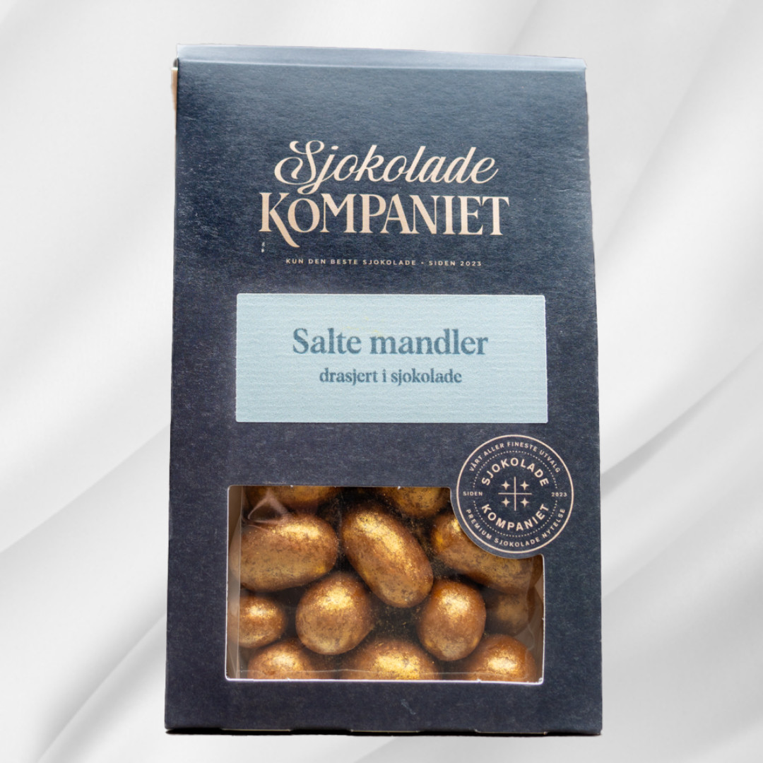 Gullfargede drasjerte mandler fra Sjokoladekompaniet, saltet, bakt og dekket med sjokolade og glans i en dekorativ påskepose.