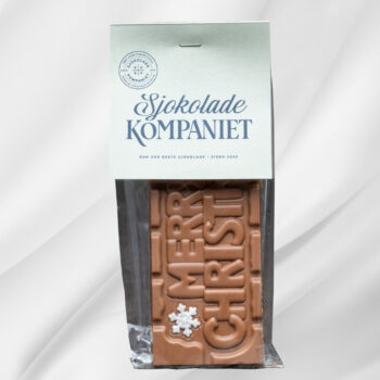 Bilde av Merry Christmas – sjokoladeplate med melk- og karamellsjokolade preget med julehilsen, en smakfull og stemningsfull gave til jul.