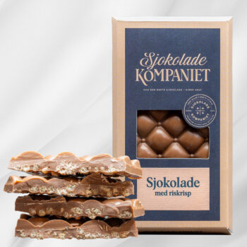 Bilde av Riskrisp – lys sjokoladeplate med karamell- og melkesjokolade, tilsatt sprø riskrisp, elegant presentert som gave.