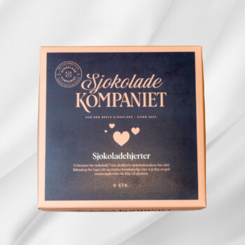 Bilde av Sjokoladehjerter – eske med ni håndlagde sjokoladehjerter i smakene salt karamell, bringebær og hasselnøtt, elegant presentert i gaveeske.