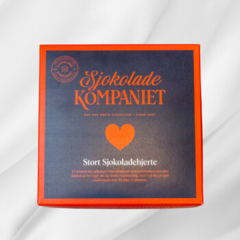 Bilde av Stort Sjokoladehjerte – stort sjokoladehjerte fylt med drasjert mais og preget med teksten «Jeg elsker deg», elegant presentert som gave.